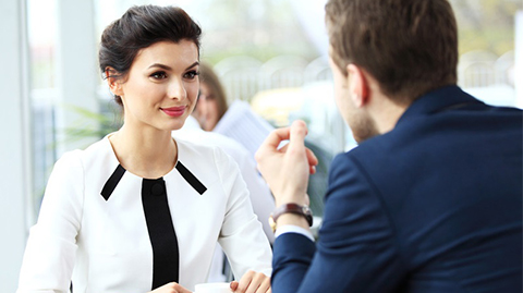 female-and-male-coworkers-having-conversation.jpg