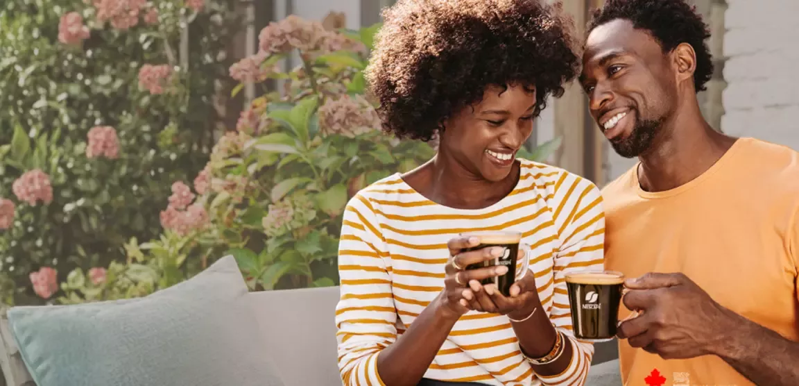 two people drinking coffee