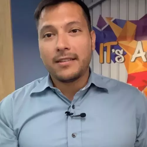 A man dressed in a blue shirt 