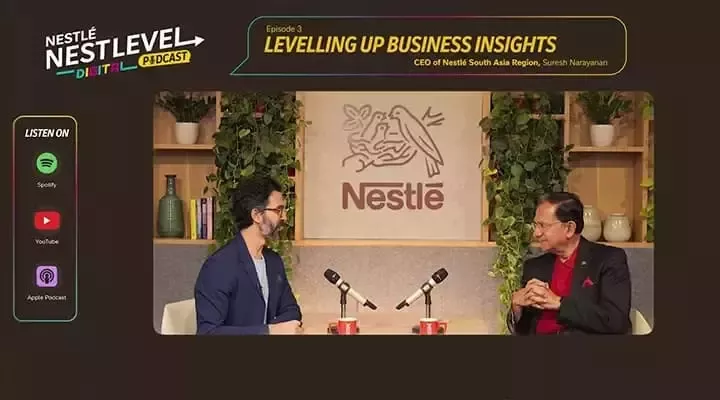 A podcast set featuring two hosts discussing business insights, with a Nestlé logo